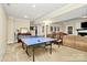 Basement with ping pong table and a lounge area at 8500 Peyton Randolph Dr, Charlotte, NC 28277