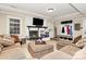 Finished basement featuring a brick fireplace and comfortable seating with a mud room at 8500 Peyton Randolph Dr, Charlotte, NC 28277