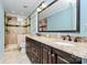 Bathroom featuring granite countertops, tile floors, double sinks, and tiled shower at 8500 Peyton Randolph Dr, Charlotte, NC 28277
