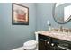 Powder room with granite vanity, modern faucet, and artistic zebra wall decor at 8500 Peyton Randolph Dr, Charlotte, NC 28277