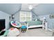 This bedroom features light blue walls, a white bed frame, and a comfortable lounging area at 8500 Peyton Randolph Dr, Charlotte, NC 28277