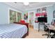 Bedroom featuring a window, wooden furnishings, and bright, colorful decor at 8500 Peyton Randolph Dr, Charlotte, NC 28277
