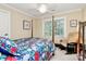 Bedroom featuring a four-poster bed, bright wallpaper, and plenty of natural light at 8500 Peyton Randolph Dr, Charlotte, NC 28277