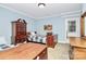 Bedroom featuring traditional wood furnishings and light blue walls with white trim detail at 8500 Peyton Randolph Dr, Charlotte, NC 28277
