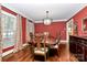 Formal dining room with hardwood floors, large windows, and elegant decor at 8500 Peyton Randolph Dr, Charlotte, NC 28277