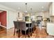 Bright kitchen with a center island, stainless steel appliances, and hardwood floors at 8500 Peyton Randolph Dr, Charlotte, NC 28277