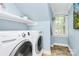 Bright laundry room with a washer and dryer at 8500 Peyton Randolph Dr, Charlotte, NC 28277