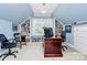 Home office with built-in bookshelves, window seat, and vaulted ceiling at 8500 Peyton Randolph Dr, Charlotte, NC 28277
