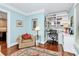 Cozy office space with custom shelving, a chair, and an open desk at 8500 Peyton Randolph Dr, Charlotte, NC 28277