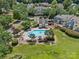 Aerial shot of a community pool surrounded by lush greenery, providing a relaxing and scenic amenity at 9136 Four Mile Creek Rd, Charlotte, NC 28277