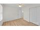 Bedroom with hardwood floors, ceiling fan and a double door closet at 9136 Four Mile Creek Rd, Charlotte, NC 28277