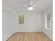 Bedroom with hardwood floors, two windows with blinds, and ceiling fan at 9136 Four Mile Creek Rd, Charlotte, NC 28277