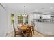 Cozy dining area with natural light and adjacent kitchen at 9136 Four Mile Creek Rd, Charlotte, NC 28277