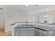 The modern kitchen features granite countertops, stainless steel appliances, and white cabinetry at 9136 Four Mile Creek Rd, Charlotte, NC 28277