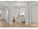 Open floor plan view into living room with fireplace and neutral décor at 9136 Four Mile Creek Rd, Charlotte, NC 28277