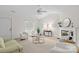 Inviting living room featuring bright natural light, neutral decor, and a cozy fireplace at 9136 Four Mile Creek Rd, Charlotte, NC 28277
