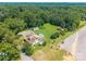 Wide aerial view showcasing the property, outbuildings and mature tree line at 106 Guffey Rd, Cherryville, NC 28021
