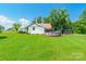 Expansive backyard with lush green grass, above ground pool and partial view of home at 106 Guffey Rd, Cherryville, NC 28021