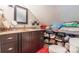Bathroom featuring a vanity with dark cabinets and storage shelves for linens and toiletries at 106 Guffey Rd, Cherryville, NC 28021