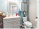 Small bathroom with a sink and toilet and light blue walls at 106 Guffey Rd, Cherryville, NC 28021