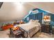 Charming bedroom featuring sloped ceilings, a patterned quilt, and inviting decor for a cozy ambiance at 106 Guffey Rd, Cherryville, NC 28021