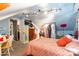 Inviting bedroom showcasing sloped ceilings, whimsical murals, and comfortable furnishings, creating a fun retreat at 106 Guffey Rd, Cherryville, NC 28021