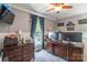 Bedroom with a ceiling fan, natural light, and dark wood furniture at 106 Guffey Rd, Cherryville, NC 28021