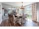 Bright dining area with stylish chandelier, views of boat on lake, and open access to kitchen at 106 Guffey Rd, Cherryville, NC 28021