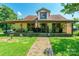 Charming home featuring a covered porch, brick pathway, and welcoming curb appeal at 106 Guffey Rd, Cherryville, NC 28021