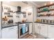 Stylish kitchen features stainless steel appliances, white cabinets, subway tile, and granite countertops at 106 Guffey Rd, Cherryville, NC 28021
