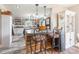 Modern kitchen featuring a central island with bar seating and open shelving at 106 Guffey Rd, Cherryville, NC 28021