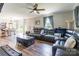 Spacious living room with hardwood floors, a ceiling fan, and a large comfortable sectional at 106 Guffey Rd, Cherryville, NC 28021