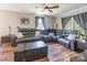 Inviting living area with a leather sectional, area rug, and a bright, airy feel at 106 Guffey Rd, Cherryville, NC 28021
