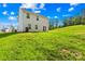 Expansive backyard with lush green lawn and a gentle slope, perfect for outdoor enjoyment and gatherings at 107 Frank Burns Way, Kings Mountain, NC 28086