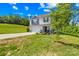 Traditional two-story house boasting a tidy front lawn and a convenient two-car attached garage at 107 Frank Burns Way, Kings Mountain, NC 28086