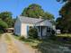 Charming cream-colored home featuring blue shutters and a well-manicured front yard at 1110 Sulfur Springs Church Rd, Shelby, NC 28152