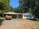 Charming single-Gathering home with a metal carport for parking and outdoor storage on a sunny day at 1110 Sulfur Springs Church Rd, Shelby, NC 28152
