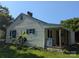 Side view of a cream-colored home with a covered porch and green lawn at 1110 Sulfur Springs Church Rd, Shelby, NC 28152