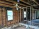 Interior view showing exposed studs and ceiling fans of a fixer-upper, awaiting renovation at 1110 Sulfur Springs Church Rd, Shelby, NC 28152