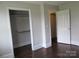 Bedroom featuring hardwood floors, closet, and neutral wall color at 1146 Buffalo St, Shelby, NC 28150