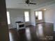 Spacious living room featuring hardwood floors, fireplace, and abundant natural light at 1146 Buffalo St, Shelby, NC 28150
