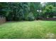 Large backyard is fenced and includes a firepit perfect for entertaining and outdoor living at 12520 Vantage Point Ln, Huntersville, NC 28078