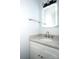 Bathroom vanity with gray marble countertop, undermount sink, and a lighted mirror at 12520 Vantage Point Ln, Huntersville, NC 28078