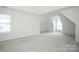 Spacious bedroom with neutral carpeting and plenty of natural light at 12520 Vantage Point Ln, Huntersville, NC 28078