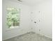 Bright bedroom featuring a window with blinds and a double-door closet at 12520 Vantage Point Ln, Huntersville, NC 28078