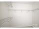 Walk-in closet with multiple shelves and rods at 12520 Vantage Point Ln, Huntersville, NC 28078
