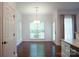 Bright dining area with hardwood floors, crown molding, and a modern light fixture at 12520 Vantage Point Ln, Huntersville, NC 28078