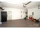 Spacious garage with epoxy floor, fridge, tool rack and modern door opener at 12520 Vantage Point Ln, Huntersville, NC 28078