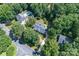 Aerial view of estate home featuring a pool and lush tree surround on a sprawling manicured lawn at 1503 Jack White Dr, Rock Hill, SC 29732