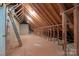 Unfinished attic with exposed rafters, a ladder, and potential for future expansion at 1503 Jack White Dr, Rock Hill, SC 29732